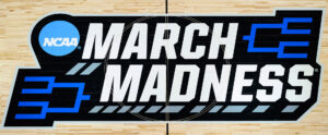 March Madness logo on the court